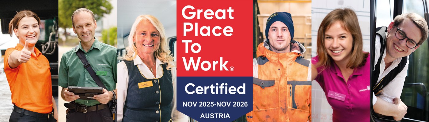Sechs Personen in Arbeitskleidung und Uniformen stehen neben einem Schild mit der Aufschrift 'Great Place To Work Certified NOV 2025-NOV 2026 AUSTRIA'.